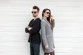 Beautiful fashionable couple models with sunglasses posing