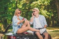 Young couple on road trip using modern technology. Modern lifestyle concept. Royalty Free Stock Photo