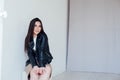 Beautiful fashionable eastern brunette woman in black leather jacket Royalty Free Stock Photo