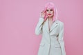 Beautiful fashionable girl attractive look white blazer pink wig studio model unaltered Royalty Free Stock Photo