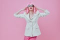 Beautiful fashionable girl in White blazer pink hair Glamor Cosmetics color background unaltered Royalty Free Stock Photo