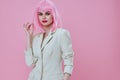 Beautiful fashionable girl in White blazer pink hair Glamor Cosmetics color background unaltered Royalty Free Stock Photo