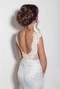 Beautiful fashionable hairstyles for young girls beautiful delicate bride in a beautiful wedding dress on a white background in th
