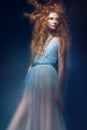 Beautiful fashionable red-haired girl in transparent dress, mermaid image with creative hairstyle curls. Fashion beauty style. Royalty Free Stock Photo