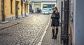 Beautiful Fashionable Woman Standing at street of old town