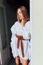 Beautiful fashionable woman in white vintage western dress