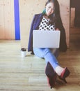 Beautiful fashionable woman working with laptop Royalty Free Stock Photo