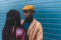 beautiful fashionable young african american couple looking at each