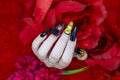 Beautiful fashionista woman acrylic fingernail coffin style painting trendy flame on thumb nail mysterious 3D black rose