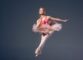 Beautiful female ballet dancer on a grey Royalty Free Stock Photo