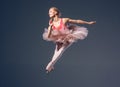 Beautiful female ballet dancer on a grey Royalty Free Stock Photo