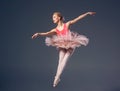 Beautiful female ballet dancer on a grey Royalty Free Stock Photo