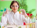 Beautiful female biotechnology scientist chemist working in lab