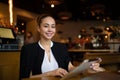 Beautiful female business owner using digital tablet
