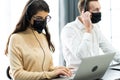 Beautiful female call center operator working on computer in office. Communication support for callcenter and customer service Royalty Free Stock Photo