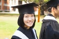 Beautiful female college graduate with classmates at ceremony Royalty Free Stock Photo