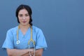 Beautiful female doctor looking at the camera in the hospital with hers arms crossed Royalty Free Stock Photo