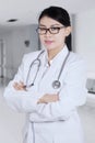 Beautiful female doctor standing in hospital Royalty Free Stock Photo