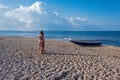 Beautiful female in the dress near boat on the sand Royalty Free Stock Photo