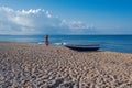 Beautiful female in the dress near boat on the sand Royalty Free Stock Photo