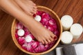 Beautiful female feet at spa salon on pedicure procedure. Royalty Free Stock Photo