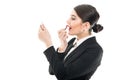 Beautiful female flight attendant putting lipstick on Royalty Free Stock Photo