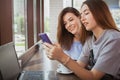 Beautiful female friends enjoying morning coffee at the cafe together Royalty Free Stock Photo