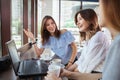 Beautiful female friends enjoying morning coffee at the cafe together Royalty Free Stock Photo