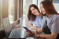 Beautiful female friends enjoying morning coffee at the cafe together Royalty Free Stock Photo