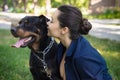 Beautiful female friends with Rottweilers