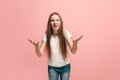 Beautiful female half-length portrait on pink studio backgroud. The young emotional teen girl Royalty Free Stock Photo