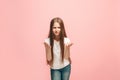 Beautiful female half-length portrait on pink studio backgroud. The young emotional teen girl Royalty Free Stock Photo