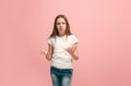 Beautiful female half-length portrait on pink studio backgroud. The young emotional teen girl Royalty Free Stock Photo