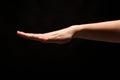 Beautiful female hand on black isolated background Royalty Free Stock Photo