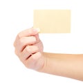 Beautiful female hand holding a gold blank card. Royalty Free Stock Photo