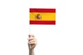Beautiful female hand holding Spain flag, isolated on white background