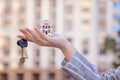 Beautiful female hand holds the keys to the house or apartment. real estate agent. Mortgage loan approval home loan and insurance. Royalty Free Stock Photo