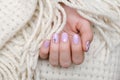 Beautiful female hand with light purple nail design Royalty Free Stock Photo