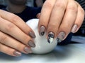 beautiful female hands with a brown manicure and fashionable design.