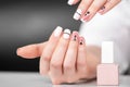 Beautiful female hands with a fashionable manicure. Geometric design of nails Royalty Free Stock Photo
