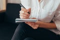 Beautiful female hands hold an open book or magazine in the room Royalty Free Stock Photo