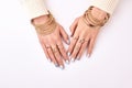 Beautiful female hands in jewelry. Royalty Free Stock Photo