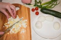 Beautiful female hands with a knife sliced boiled egg Royalty Free Stock Photo