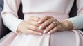 Hands of the bride with wedding nail design