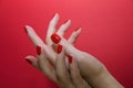 Beautiful female hands with red manicure and nail isolated Royalty Free Stock Photo