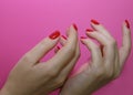 Beautiful female hands with red manicure and nail isolated Royalty Free Stock Photo