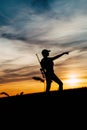 Female Hunter silhouette in Sunset. Royalty Free Stock Photo