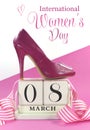 Beautiful female icon pink high heel shoe with vintage shabby chic wood calendar for March 8, International Womens Day Royalty Free Stock Photo