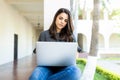 Female Keyboarding On Laptop While Sitting At Campus Royalty Free Stock Photo