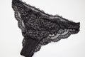 Beautiful female lacy black panties isolated on white background Royalty Free Stock Photo